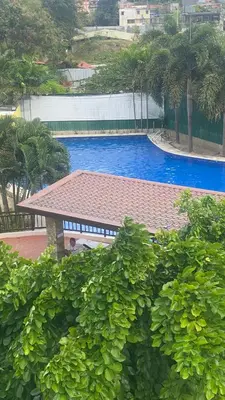 a view of a swimming pool with a pavilion at Staycation One bedroom in Manila