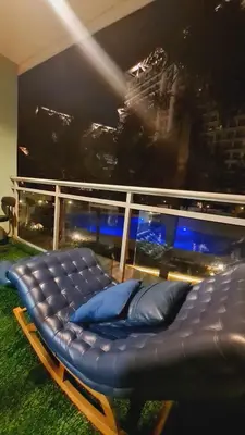 a bed with pillows in a room with a window at Azure Paranaque near Airport in Manila