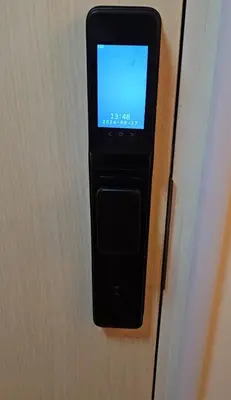 a cell phone is attached to a door at Dlighful Pad's MassageChair FreeParking Bar Park Garden in Manila