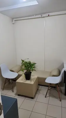 a room with a couch and two chairs and a plant at URBAN DECA R1125 Ortigas SM EAST in Manila