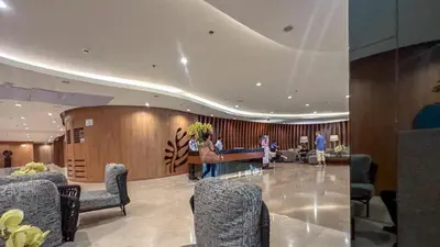 a lobby with people sitting in a waiting room at Oasis Urban Stay 2 in Manila