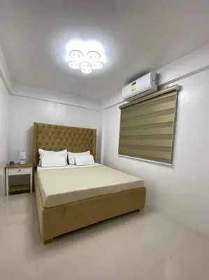 a bedroom with a bed with a thermometer on the ceiling at House Tahhánne in Amadeo