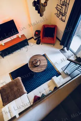an overhead view of a living room with a table at Cozy Loft in Makati in Manila