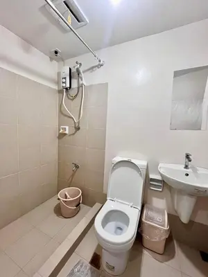 a bathroom with a toilet and a sink at Condo in silang - near nuvali and tagaytay in Silang