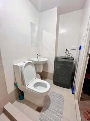 a bathroom with a toilet and a sink at Condo in silang - near nuvali and tagaytay in Silang