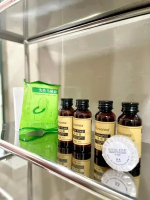 a shelf with four bottles of jam in a refrigerator at Spacious 2-BR unit in One Uptown Residences in Manila