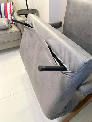 a couch laying on a floor in a living room at Spacious 2-BR unit in One Uptown Residences in Manila