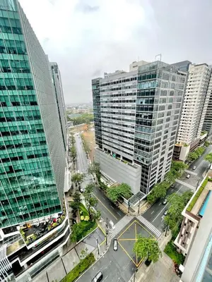 an aerial view of a city with tall buildings at Spacious 2-BR unit in One Uptown Residences in Manila