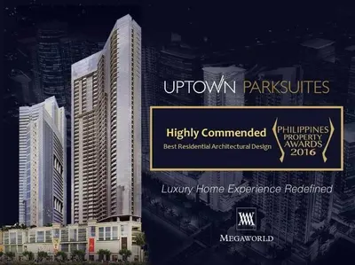 a sign for uptown park buildings in a city at Executive Gem beside Malls and Bars at Uptown BGC in Manila