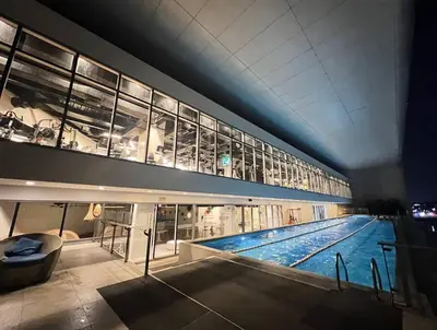 a large swimming pool inside of a building at Skyloft Acqua Private Residences in Manila