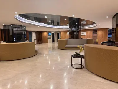 a lobby with a circular ceiling in a building at Jai Suite K&J Cozy Place Staycation in Manila