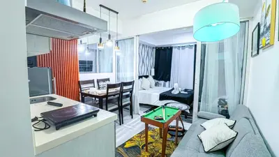 a living room with a couch and a table at Stunning 1-Bed Apartment in Paranaque in Manila