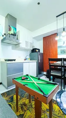 a kitchen with a ping pong table in a room at Stunning 1-Bed Apartment in Paranaque in Manila