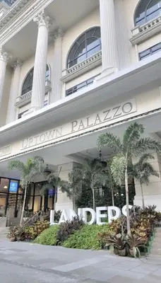 a building with a sign on the front of it at 2BR at the FORT BGC near Malls, Restaurants & Shops in Manila
