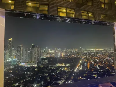 a view of a city skyline at night at Quiet Condo with Fast WiFi, Own Balcony, Pool and Gym in Manila