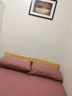 a bed with two pillows on top of it at Moa SHORE 3 TOWER 2 RESIDENCE in Manila