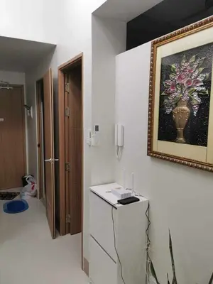 a room with a picture of a vase on the wall at Mao shore 3 residence tower 2 in Manila