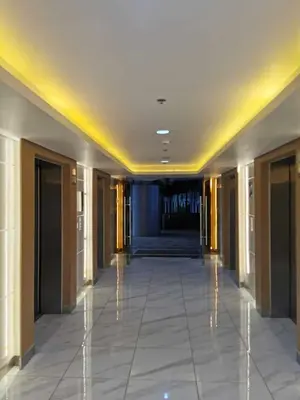 a hallway of a building with a hallwayngth at Shore 3 residence Moa Pasay in Manila