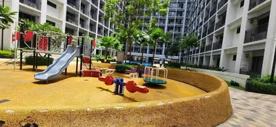 a playground in front of a building with a slide at Perfect blend of home & comfort in Manila