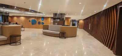 a lobby with couches and tables in a building at Perfect blend of home & comfort in Manila