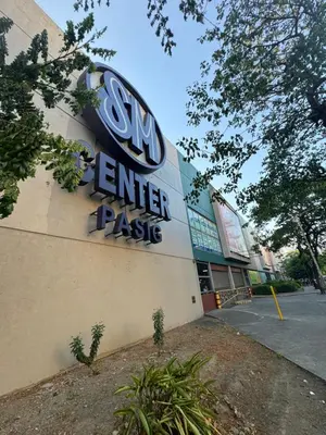 a building with a sign for a car dealership at Mayas Home in Pasig Aesthetic and Cozy with Pool access and Netflix in Manila