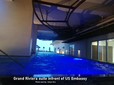 a swimming pool with blue lighting in a building at Manila Condotel near US Embassy in Manila