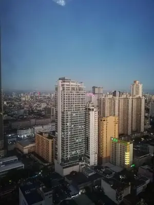 a view of a city with tall buildings at Manila Condotel near US Embassy in Manila