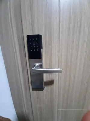 a close up of a door with a handle at Cozy Shore Residence with balcony near Mall of Asia & airport in Manila