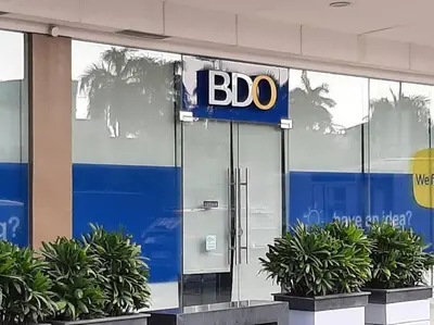 a bdo sign on the side of a building at Cozy Shore Residence with balcony near Mall of Asia & airport in Manila