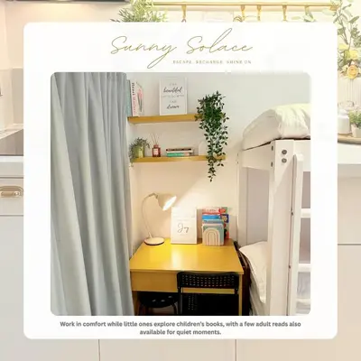 a bed room with a desk and a bunk bed with a bunk bed frame at Sunny Solace a Homey Condo in Filinvest Alabang in Manila