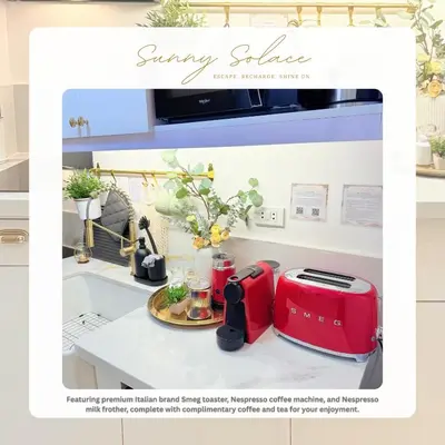 a kitchen with a red toaster on a counter at Sunny Solace a Homey Condo in Filinvest Alabang in Manila