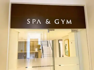 a sign for a spa and gym in a store at BGC Skyline 2BR Suite with Parking in Uptown BGC in Manila