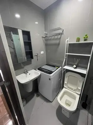 a small bathroom with a sink and a toilet at Destina at Air Residences, Makati, Metro Manila in Manila
