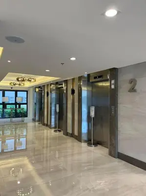 a building with a hallway with elevators in it at 1014 - Cavite Minimalist Condo with Resort-like Amenities & Hi Speed Wifi in Dasmariñas