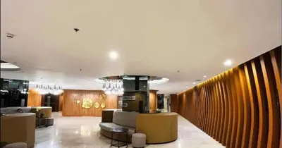 a lobby with couches and chairs in a building at Shore 2 Residences high speed Internet walking distance to MOA and IKEA in Manila