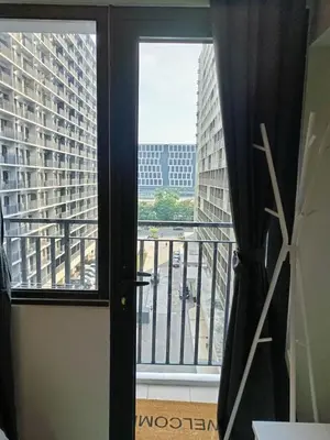 a room with a window with a view of a building at Shore 2 Residences high speed Internet walking distance to MOA and IKEA in Manila