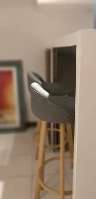 a black chair sitting in front of a desk at WNSuites in Manila
