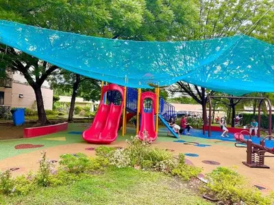 a playground with a slide in a park at WNSuites in Manila