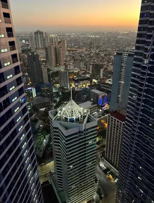 an aerial view of a city with tall buildings at COZY SKYLINE CONDO in MAKATI in Manila