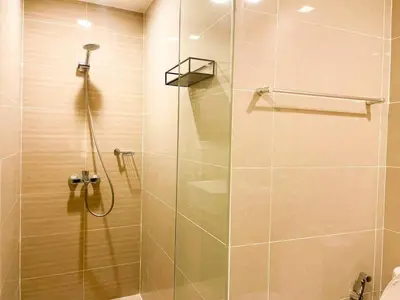 a shower with a glass door in a bathroom at Luxurious Modern BGC Condo at Uptown #upt131h in Manila