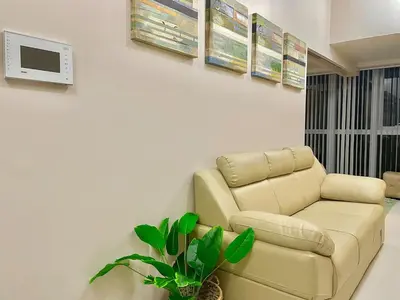 a living room with a couch and a tv at Prime BGC Condo Near Grand Hyatt #upt131q in Manila