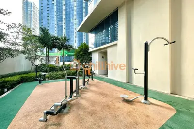 a row of gym equipment on the side of a building at Prime BGC 1BR Near Mitsukoshi Mall #upt16m in Manila