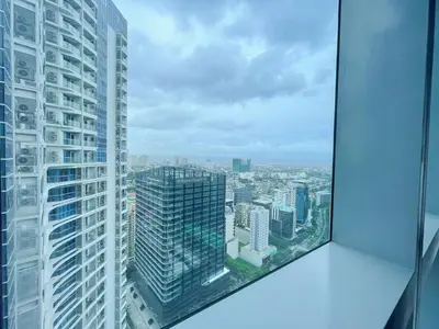 a view of a city from the top of a skyscraper at Exclusive BGC Condo at Uptown Area #upt136d in Manila