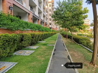 an empty sidewalk in front of a building at 2-bedroom with Balcony in a Resort Setting - H Ivory in Manila