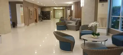 a lobby with chairs and a couch and a table at BLUE sea Residences in Manila