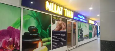 a sign in a shopping mall with a massage room at BLUE sea Residences in Manila