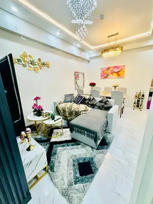 a living room with a couch and a table at Gina Staycation The Atherton DMCI Parañaque in Manila