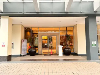 a store front with a door in a building at LA Amore Place Aspire Tower Nuvo City Libis in Manila