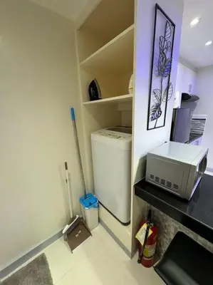 a kitchen with a small refrigerator and a microwave at The Quin Place 1BR 200Mbps WIFI in Manila