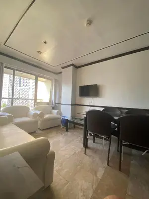a living room with a couch and a table at Fernandina 88 Suites Condo in Manila